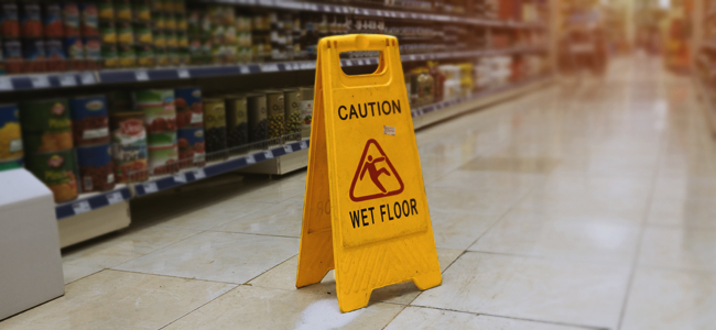 Suing for a Supermarket “Slip ‘n Trip” – What Must You Prove? yellow sign caution wet floor